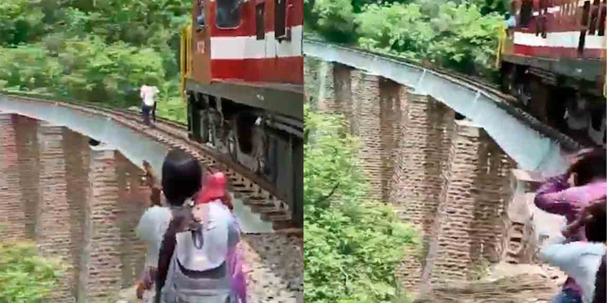 Schokkende video: Koppel springt van 27 meter hoge brug om trein te ontwijken